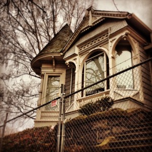 The 1884 Bridges House in Portland isprepared for demolition in this January 24,2014, photo. Despite being listed in theHistoric Resources Inventory and cited as aprime example of the Eastlake Style in ClassicHouses of Portland, the house had no formalprotection to slow or stop the demolition permitrequest (Restore Oregon Instagram photo).