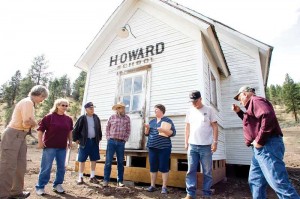 Photo Credit: Kevin Sperl, Central Oregonian - Sharon Allured (far left), Val Grubbe, Bill Grubbe, Gerry Grubbe, Lucy Woodward, Bill Quant, and Merle Williams gather around the recently relocated Howard School building.