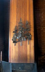 Tree sculpture over the fireplace made by Verne Nelson